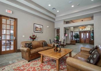 a living room with couches and a coffee table